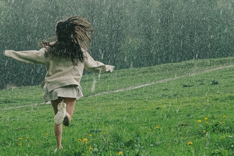 Girl running in the rain