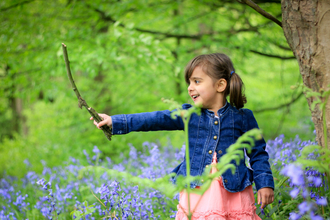 Child in bluebell wood - Photo: Tom Marshall