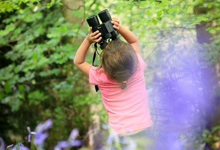 Child in bluebell wood - Photo: Tom Marshall / Wildnet