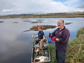 Trust staff at Two Tree Island nature reserve giving thumbs up 