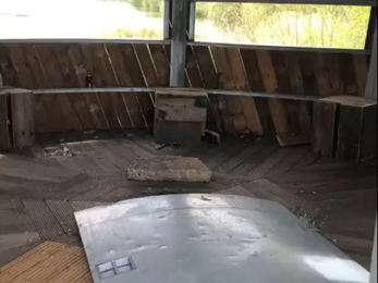 Broken door and damage to bird hide