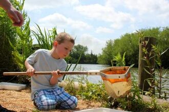 Child with pond net