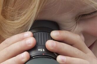Abberton girl looking through scope 