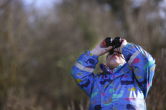Girl with binoculars