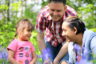 Family in bluebell wood - Photo: Tom Marshall / Wildnet