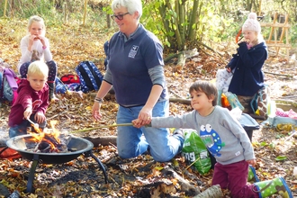 Forest school group in woodland