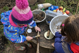 Children playing in mud kitchen
