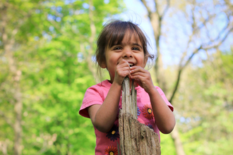 Child in bluebell wood - Photo: Tom Marshall