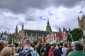 A crowd gathered outside of Westminster for the "Restore Nature Now" march.