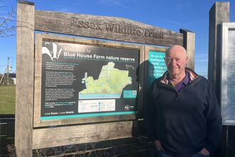 Alan Minister next to the Blue House Farm nature reserve sign