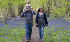Family in bluebell wood