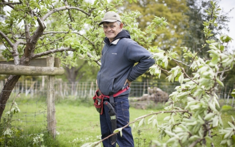 Martin stands in a garden