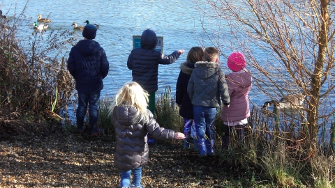 children by the lake