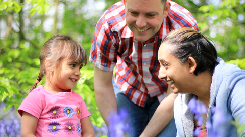 Family in bluebell wood - Photo: Tom Marshall / Wildnet