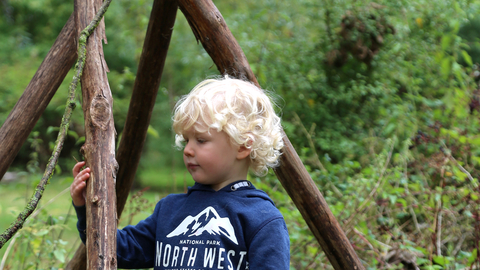 Boy looking at log