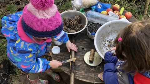 Children playing in mud kitchen