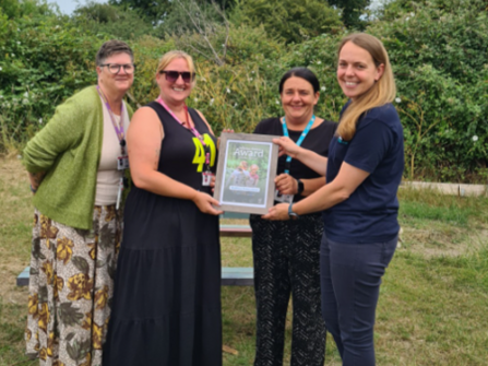 Mayflower Primary School representatives with Judith Metcalfe, holding award.