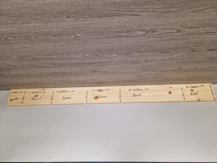 Wooden plank with marked out sections for a nestbox