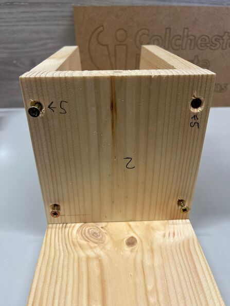 Fitting the sides to the back panel.