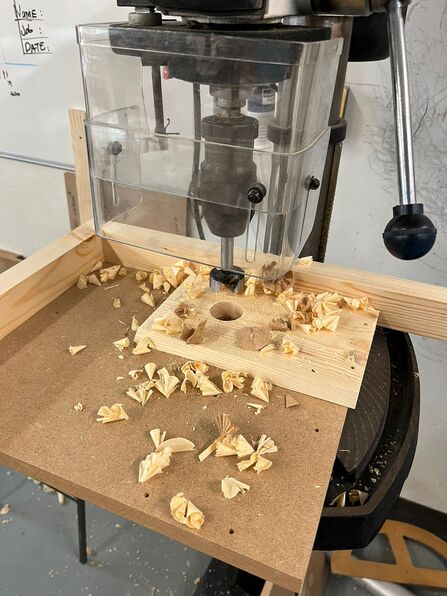 Drilling the entrance hole.