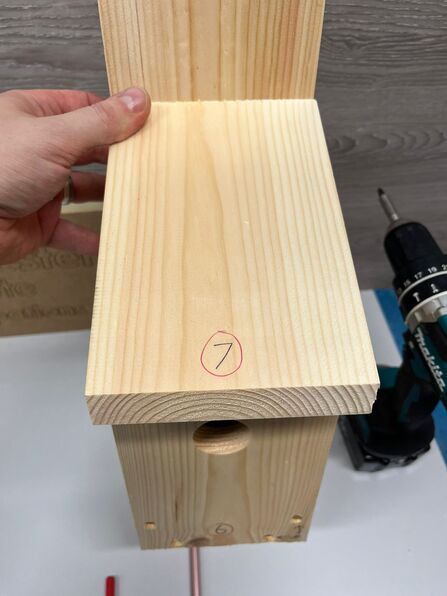 Attaching roof to nest box.