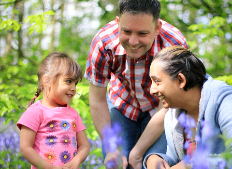 Family in bluebell wood - Photo: Tom Marshall / Wildnet