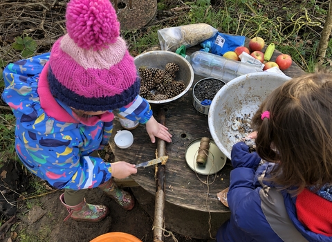 Children playing in mud kitchen