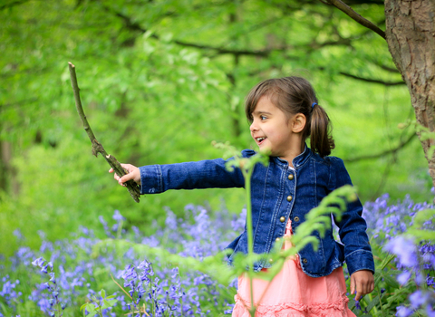 Child in bluebell wood - Photo: Tom Marshall